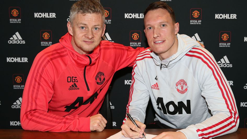 Manchester United interim Ole Gunnar Solskjaer (left) and defender Phil Jones (right), who signed a new contract