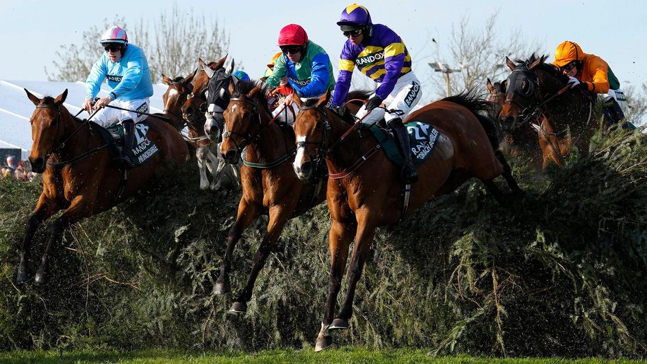 Corach Rambler (purple and yellow silks) in action at Aintree