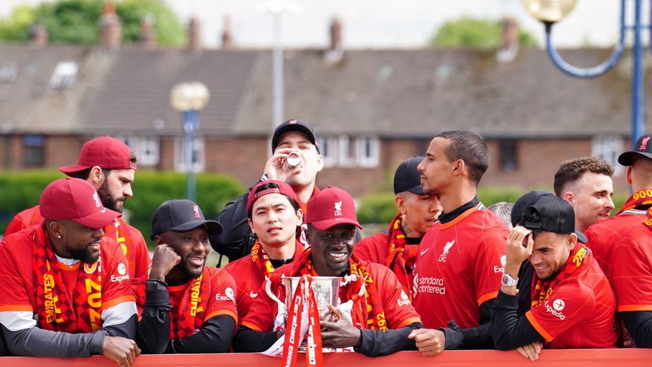 Liverpool's players on a victory parade to celebrate their season