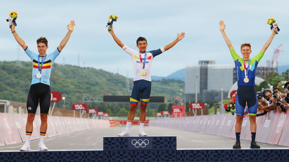 Wout van Aert (left), Richard Carapaz (centre) and Tadej Pogacar on the podium
