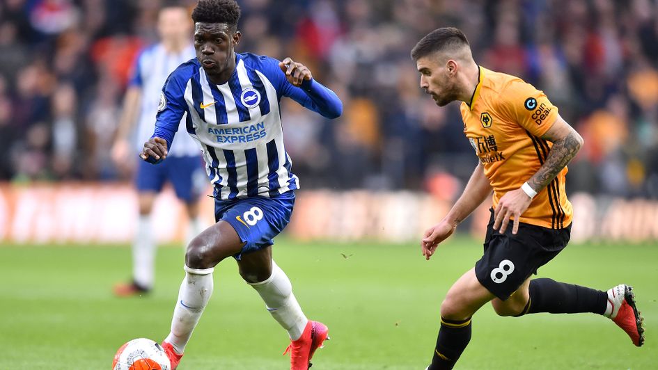 Brighton's Yves Bissouma gets away from Wolves Ruben Neves