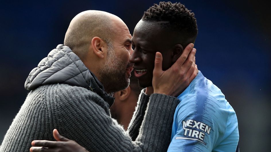 Pep Guardiola with Benjamin Mendy following Manchester City's latest win