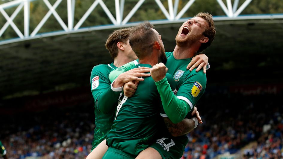 Celebrations for Sheffield Wednesday after Sam Winnall's (right) goal at Huddersfield