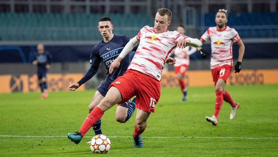 Lukas Klostermann and Phil Foden battle for possession