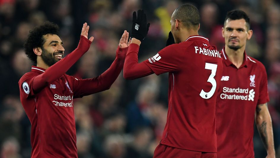 Liverpool's Fabinho, Mohamed Salah and Dejan Lovren celebrate another win