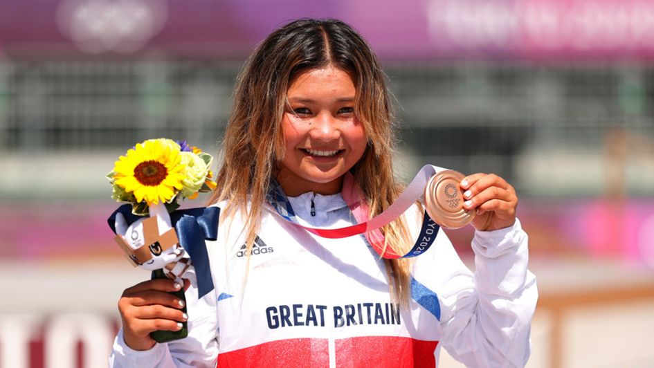 Sky Brown celebrates with her bronze medal
