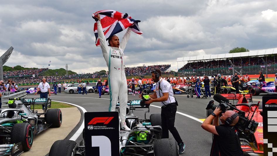 Lewis Hamilton celebrates his history-making victory at Silverstone