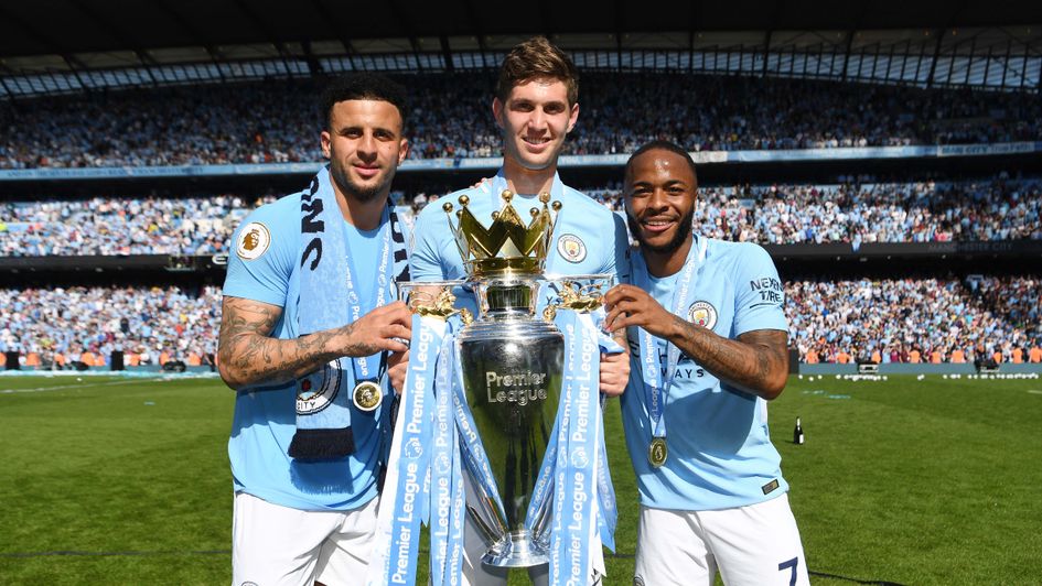 John Stones, Kyle Walker and Raheem Sterling with the Premier League trophy