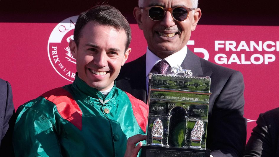 Mickael Barzalona holds the winner's trophy