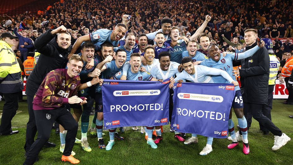Burnley players celebrate promotion to the Premier League
