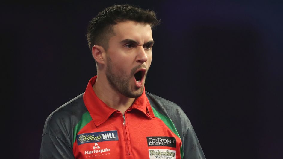Jamie Lewis celebrates against Peter Wright