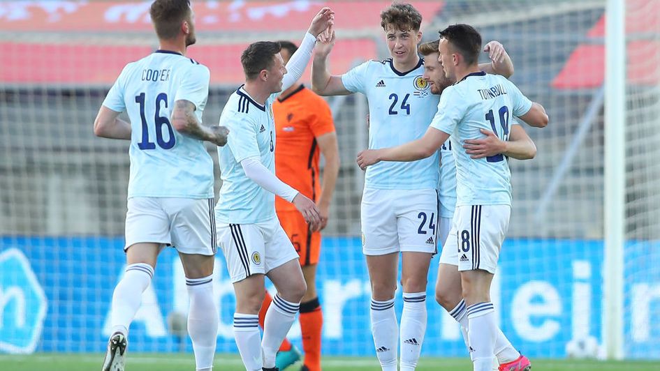 A weakened Scotland side showed their mettle with an encouraging 2-2 draw against Holland in Portugal.