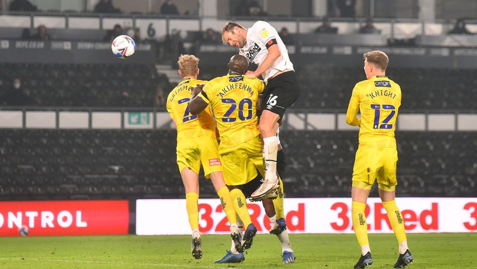 Matthew Clarke gets a shot away against Wycombe