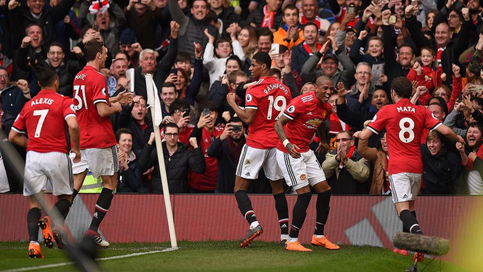 Manchester United players celebrate after taking the lead at Old Trafford
