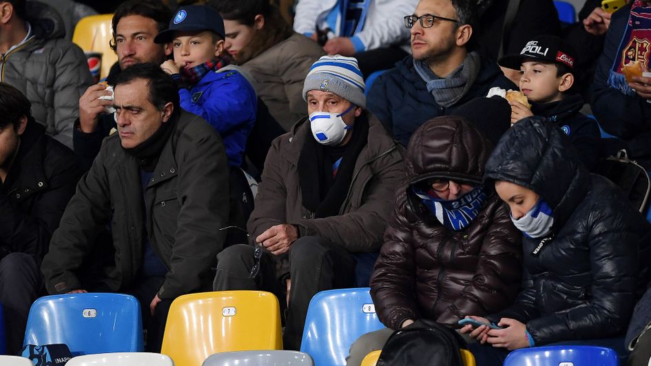 Fans wear masks during Napoli's Champions League home game with Barcelona