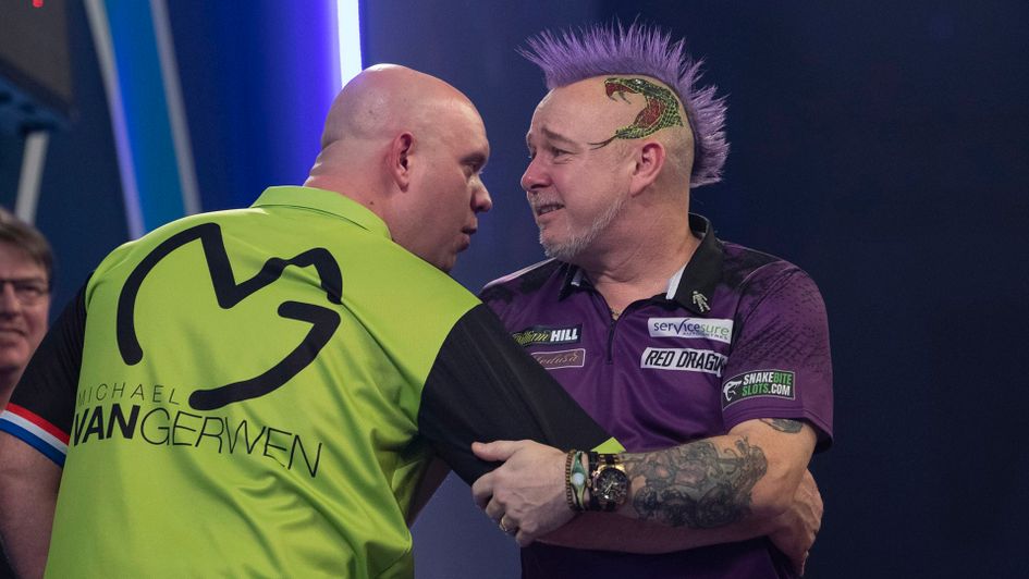 Michael van Gerwen congratulates Peter Wright at the end of the World Championship final