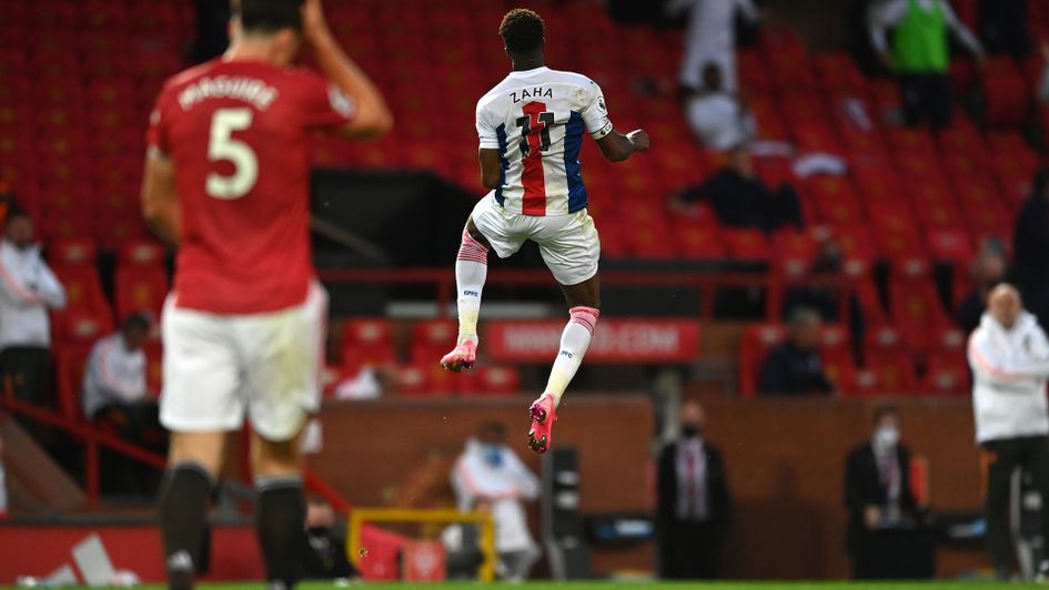 Wilfried Zaha celebrates his strike at Old Trafford