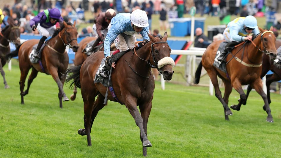 Machadadorp, ridden by Oisin Murphy, on their way to winning the British EBF Fillies' Handicap