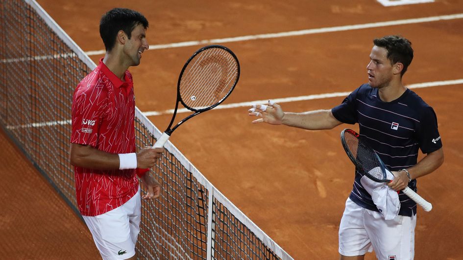 Diego Schwartzman, right, was defeated by Novak Djokovic in Italy