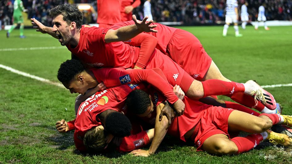 Sam Austin of Kidderminster celebrates after scoring against Reading