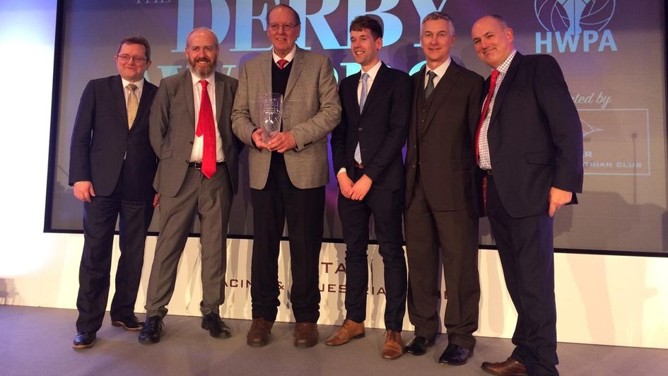 Geoff Greetham, flanked by former Timeform colleagues, with his Lifetime Achievement award