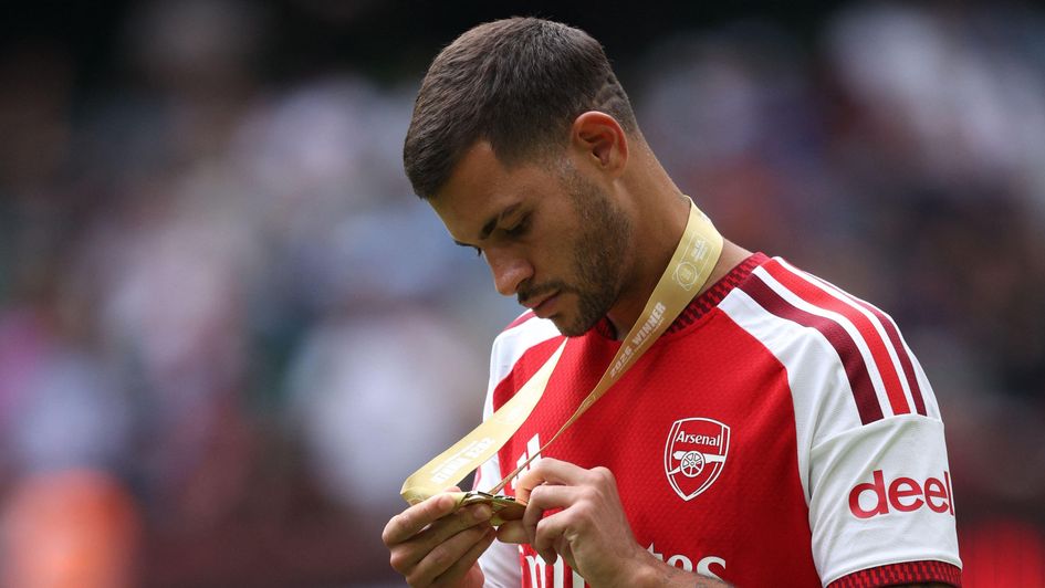 Bruno Guimaraes examines his Community Shield winners medal