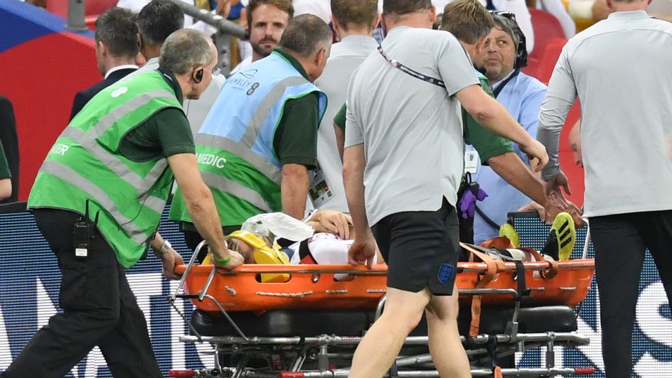 Luke Shaw is stretchered off after a collision in England's defeat to Spain
