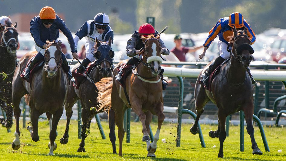 Miss Yechance (red cap) claims the Prix de l'Abbaye