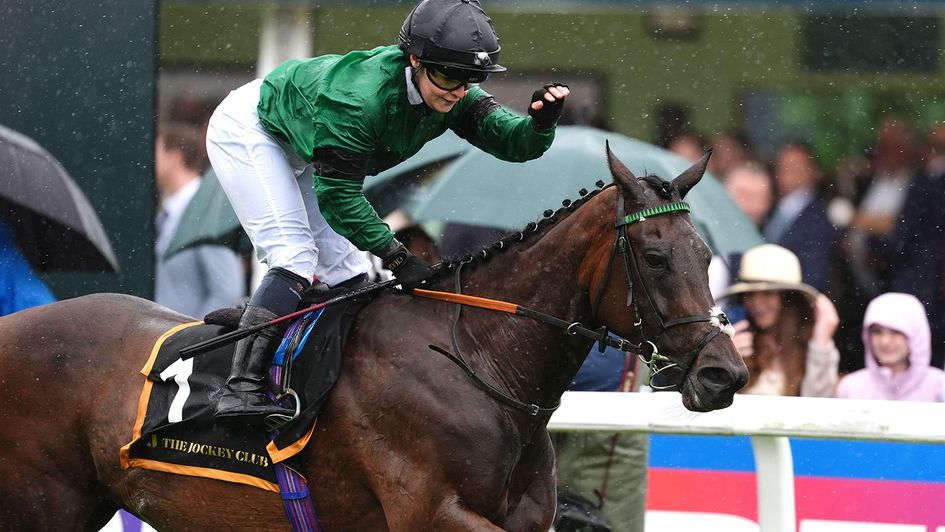 A delighted Laura Pearson pats the winner Sparks Fly
