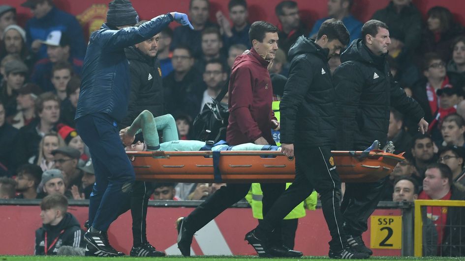 Rob Holding is stretchered off at Old Trafford