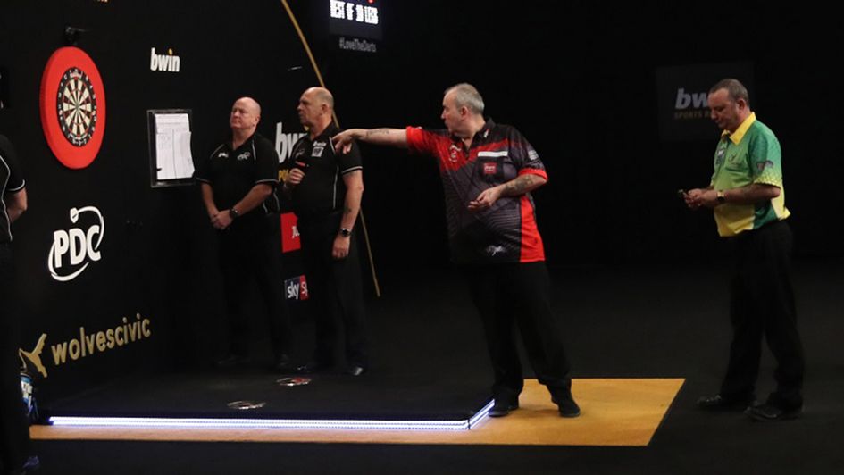 Phil Taylor in action against Darren Webster (Picture: Lawrence Lustig/PDC)