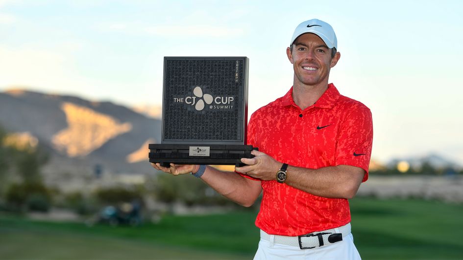 Rory McIlroy celebrates with the trophy after winning THE CJ CUP