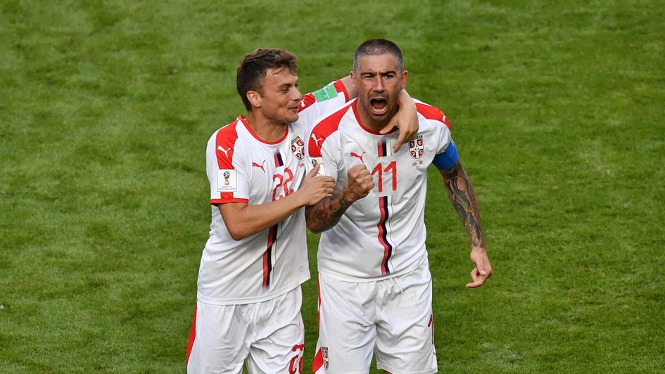 Aleksandar Kolarov (right) celebrates his goal at the World Cup with Serbia team-mate Adem Ljajic