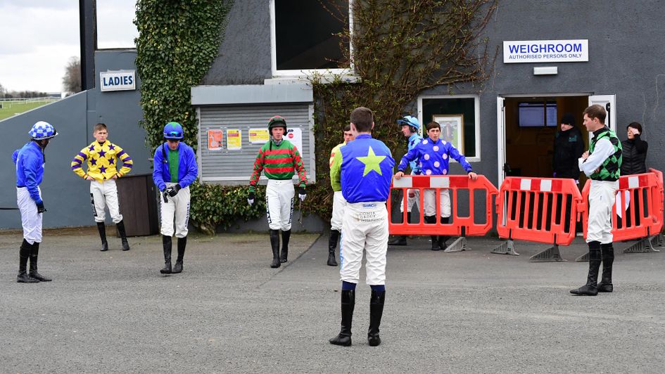 Jockeys wait to enter the Weighing Room at Thurles