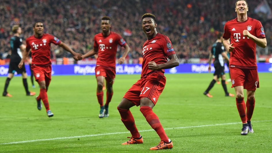 Bayern players celebrate on their way to a 5-1 victory over Arsenal