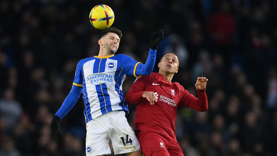Adam Lallana battles for possession with Thiago Alcantara