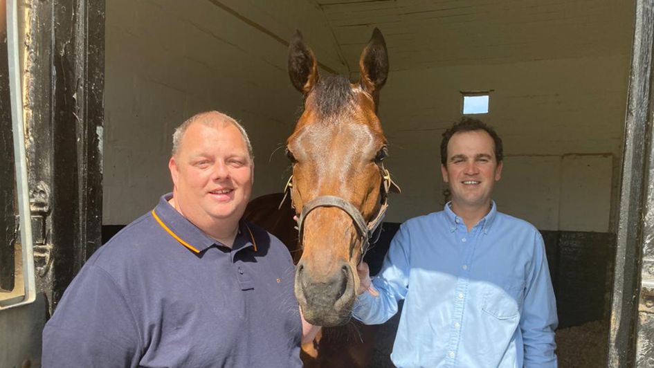 Lee Chipchase and Rogue Millennium with trainer Tom Clover (right)