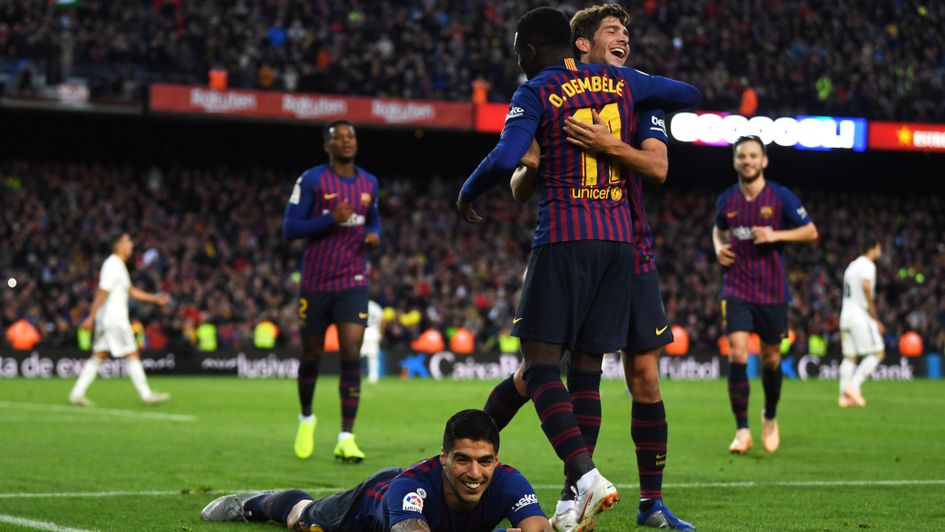 Luis Suarez (bottom) celebrates his goal for Barcelona in El Clasico