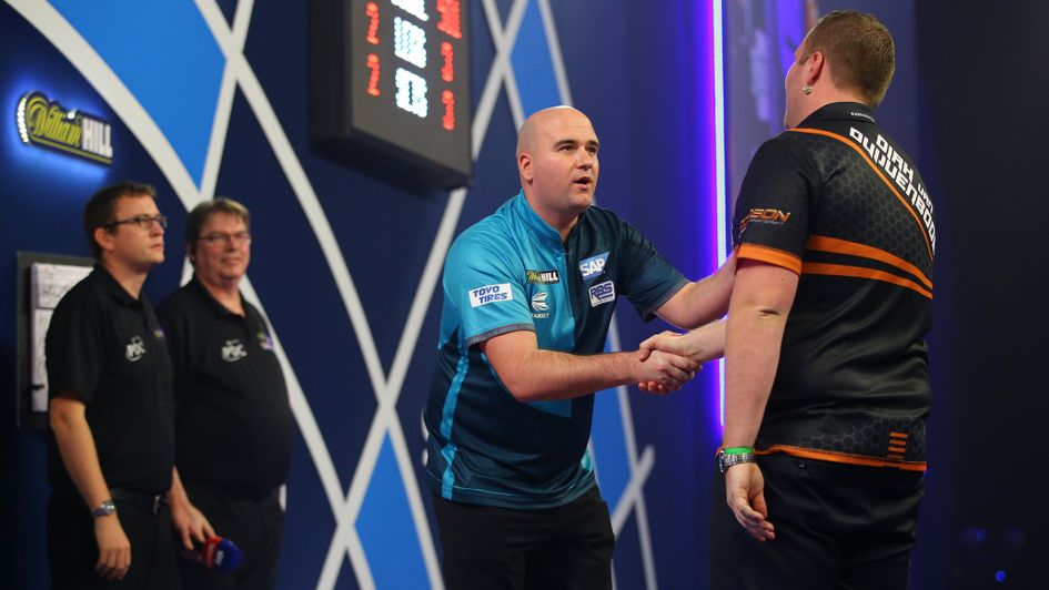 Dirk van Duijvenbode is congratulated by Rob Cross (centre)