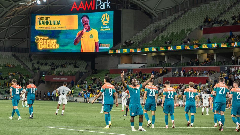 Nestory Irankunda celebrating scoring for Australia