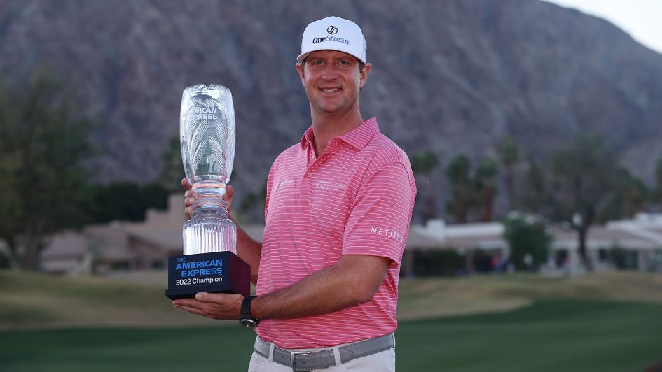 Hudson Swafford celebrates with the winner's trophy after winning The American Express