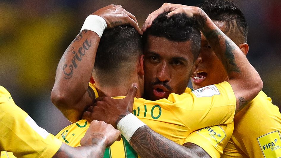 Philippe Coutinho (l) and Paulinho are Brazil team-mates