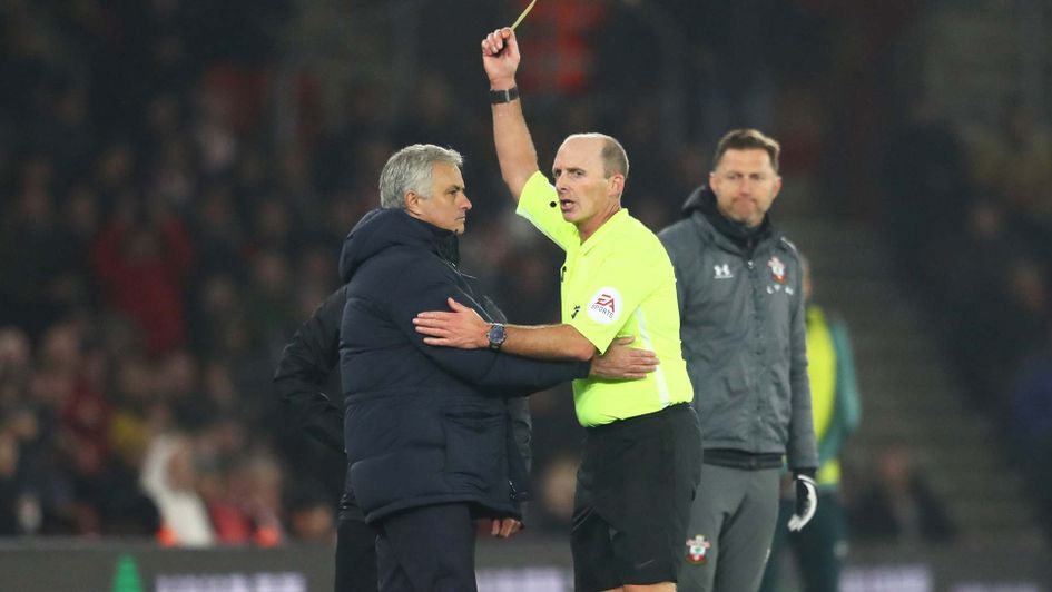 Jose Mourinho is booked by referee Mike Dean during Tottenham's defeat at Southampton