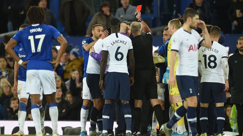 Son Heung-Min is shown a red card by Martin Atkinson