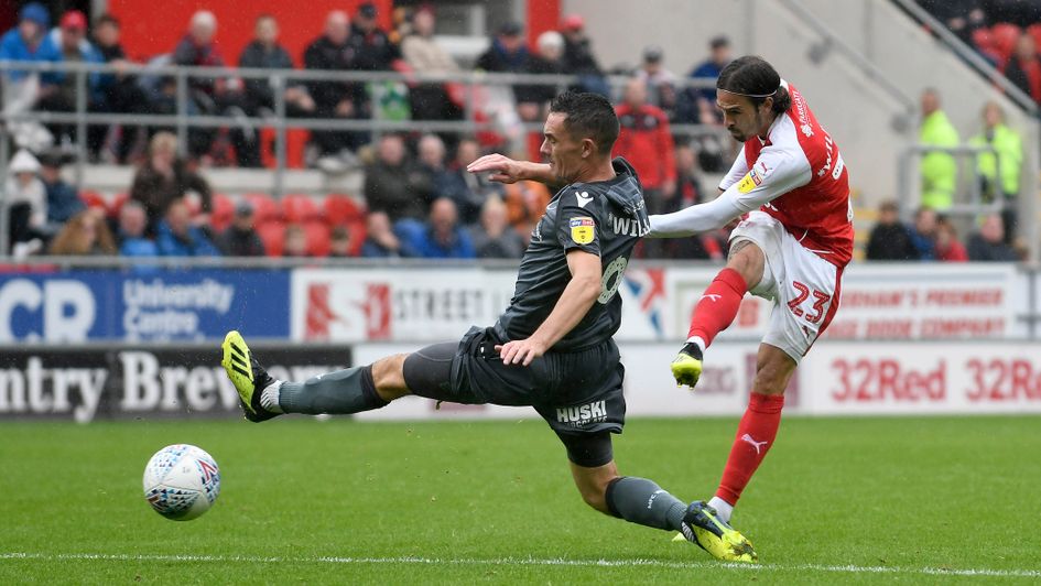 Rotherham's Ryan Williams fires in a shot past Millwall's Shaun Williams