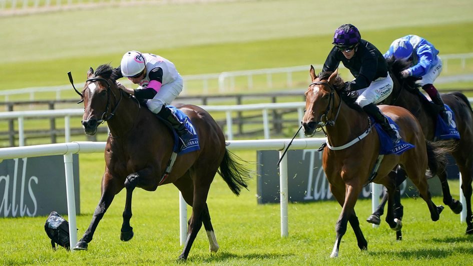 Porta Fortuna, ridden by Ryan Moore (left), comes home to win the Lanwades Stud Stakes