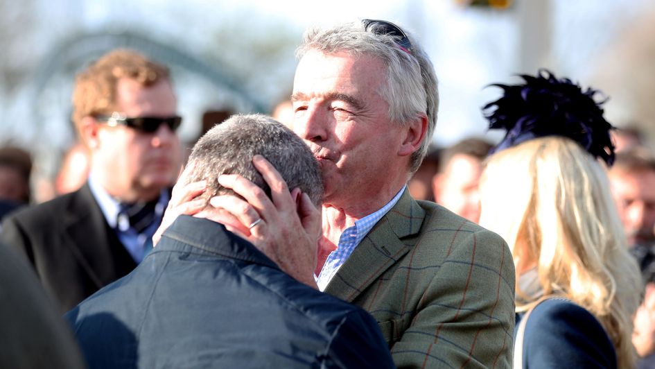 There's a kiss for the winning trainer from the winning owner