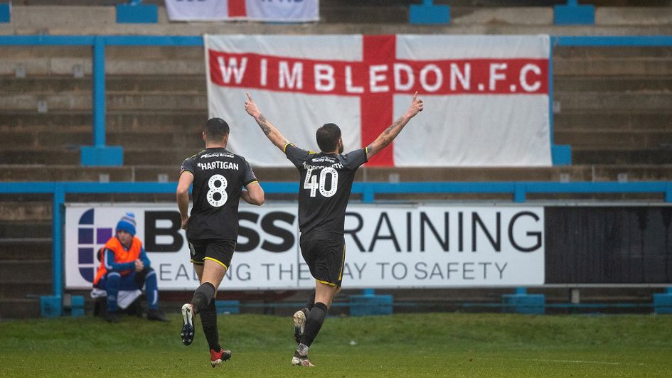 AFC Wimbledon's Anthony Wordsworth (right) celebrates scoring their second goal against FC Halifax Town