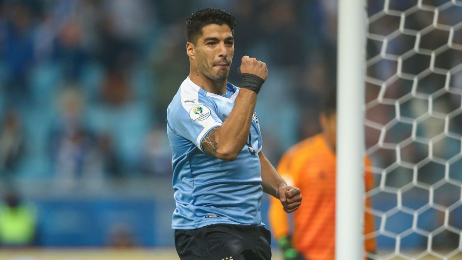 Luis Suarez slotted home a penalty for Uruguay in their 2-2 draw with Japan