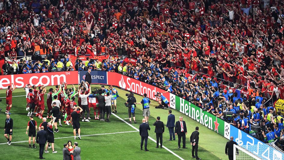 Liverpool celebrate winning the Champions League in front of their supporters